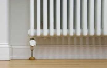 Geothermal Energy Piped Hot Water Through Radiators - iStockPhoto