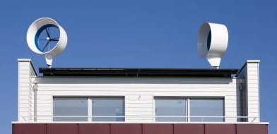 Residential Wind Turbine Pair Above Netherlands Rooftop - iStockPhoto