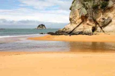 Tidal Power Revealed By Water Level Changes Kaiteretere Beach New Zealand - iStockPhoto