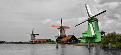 Dutch Windmills on canal - iStockPhoto